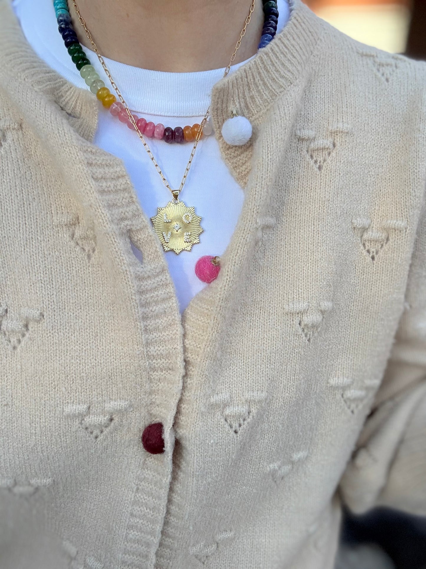 Large, bold 'Love' disc charm with a sleek design, perfect for adding a statement touch to any bracelet or necklace.