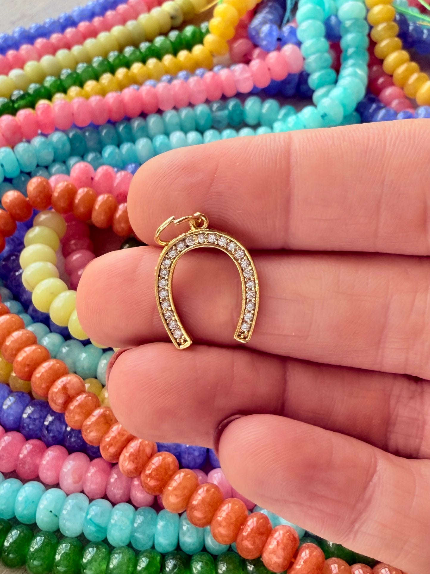 Horseshoe charm symbolizing good luck, perfect for adding a stylish and meaningful touch to any necklace.