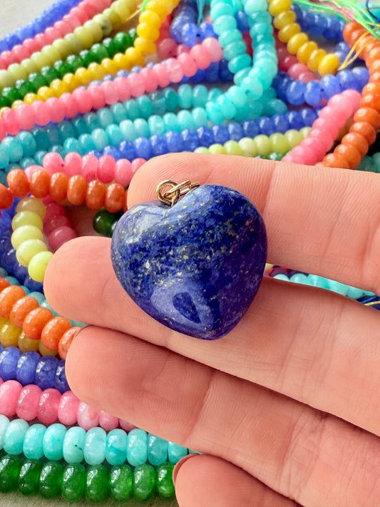 A blue puffy heart charm, featuring a fun and bold design for personalized necklace designs.