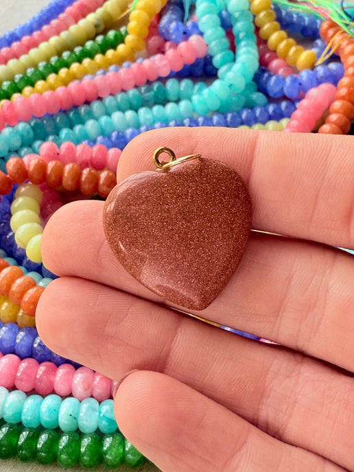 Vibrant puffy heart charms in various bright colors, perfect for adding a playful touch to any stack or necklace.