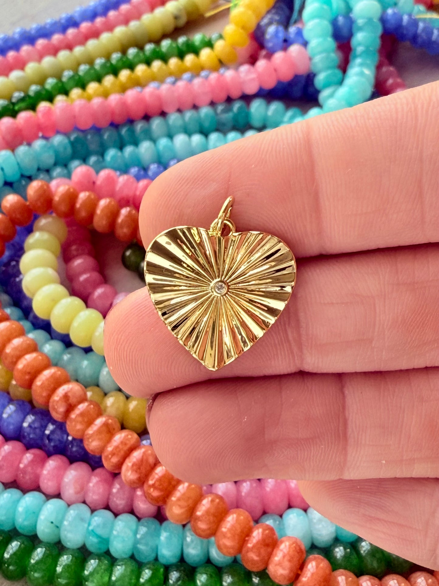 Stunning heartburst charm with a dynamic design, perfect for adding a burst of love and sparkle to any necklace.