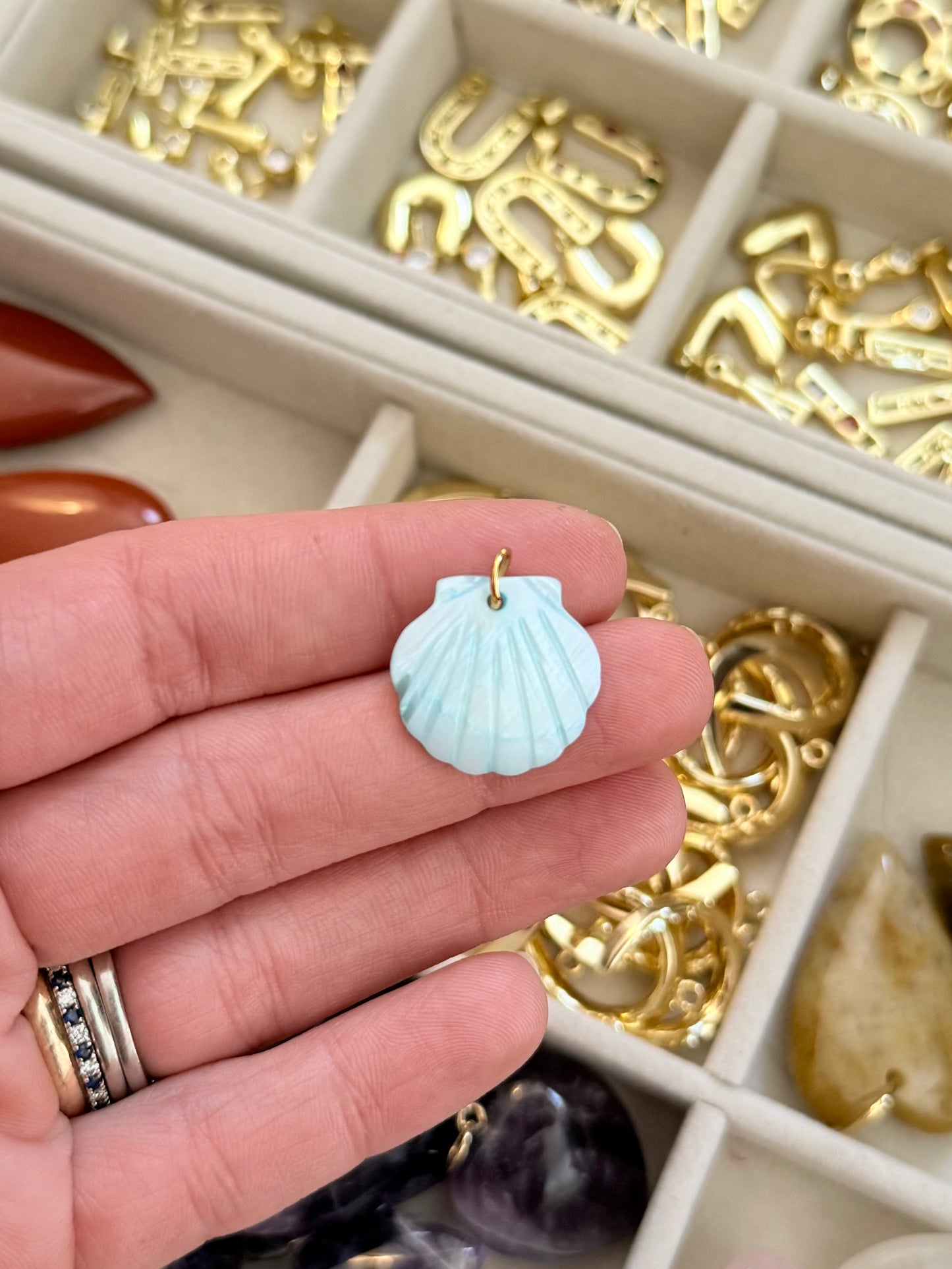 carved shell charm