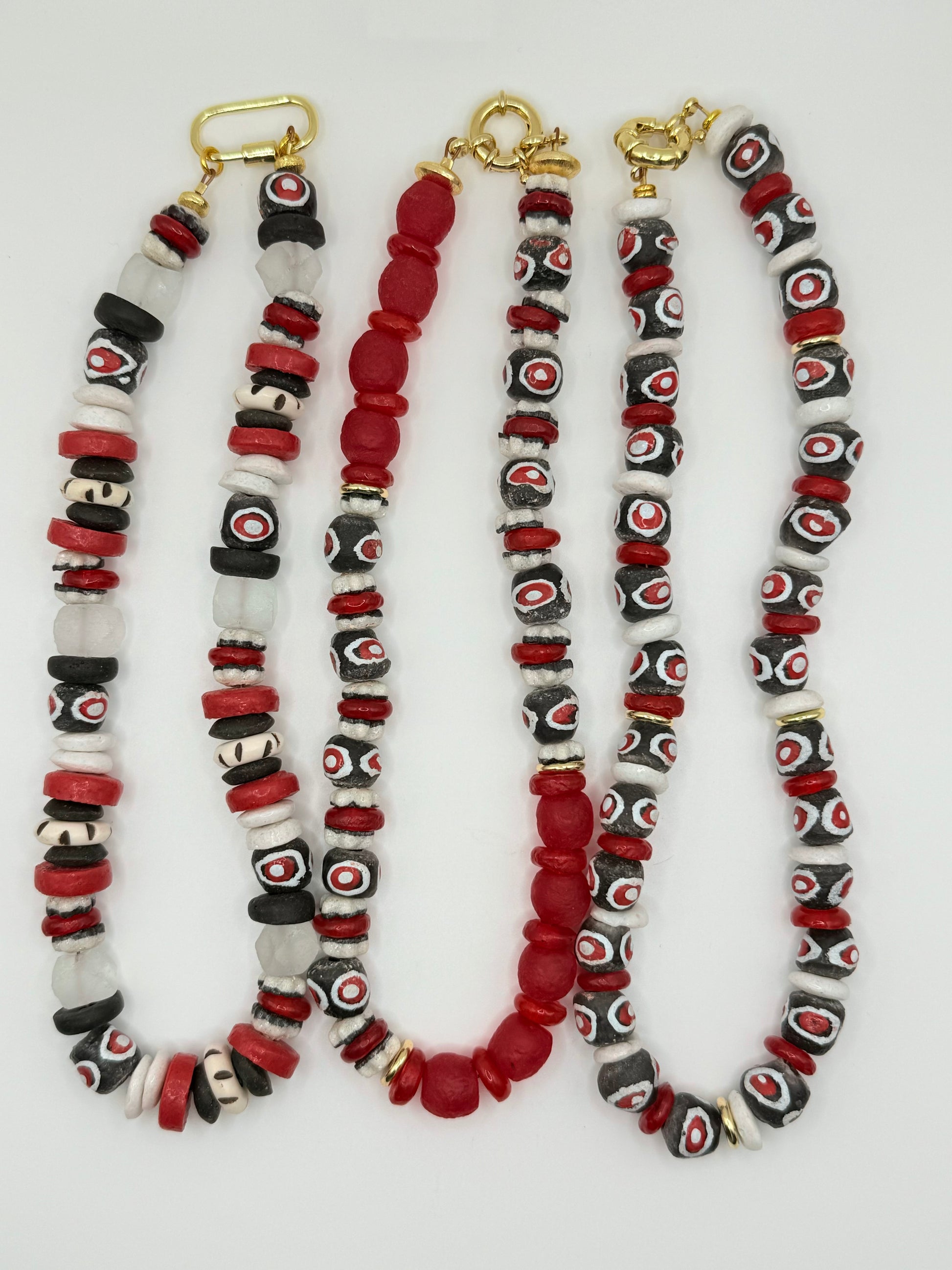 Vibrant red, white and black beaded necklace, designed to enhance your look with contrasting colors.