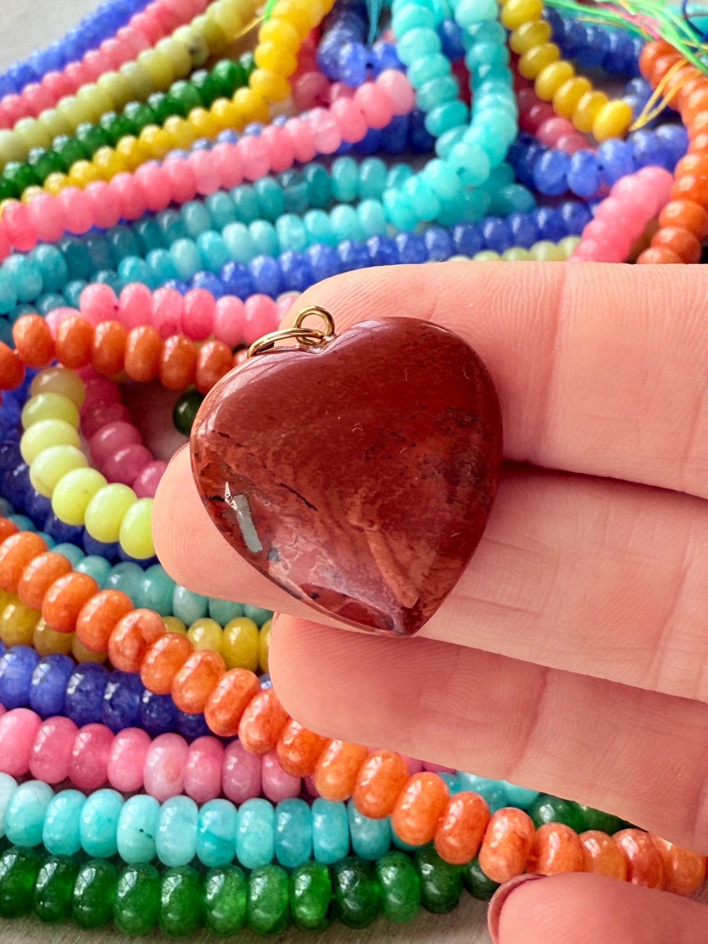 Rust puffy heart charmswith a soft, rounded design, perfect for adding a bit of fun to a necklace. 