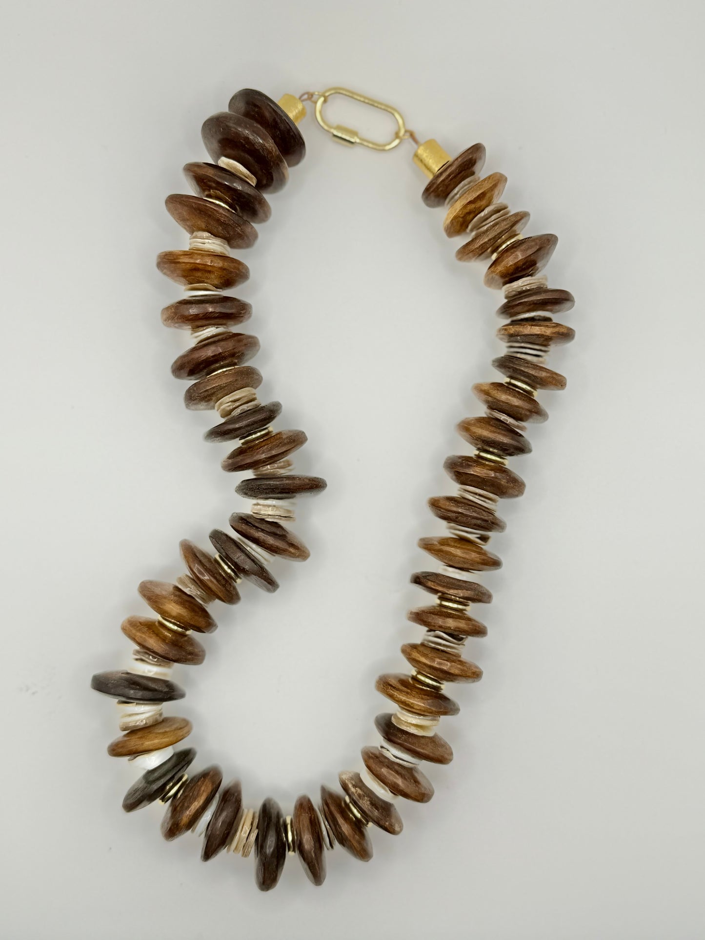 Fashionable brown wooden chunky necklace designed with chunky wooden beads, adding a touch of nature-inspired charm.