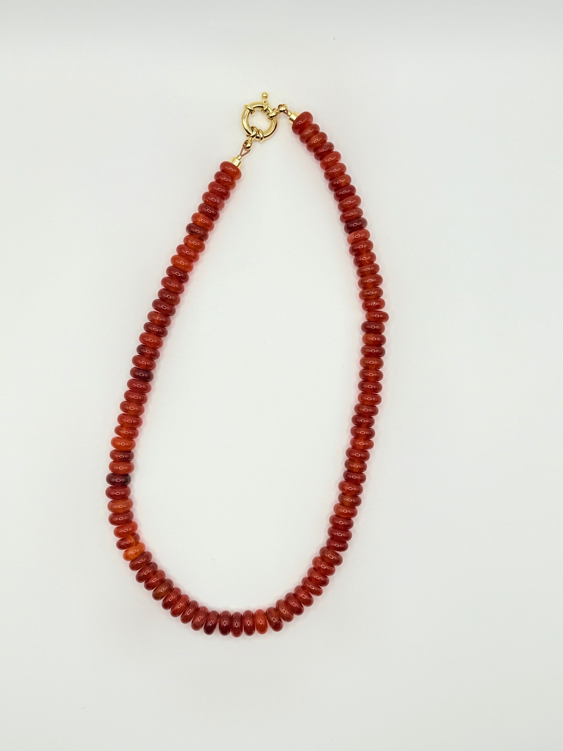 Stunning red beaded necklace with vibrant, round beads, ideal for bold fashion statements or unique accessories.