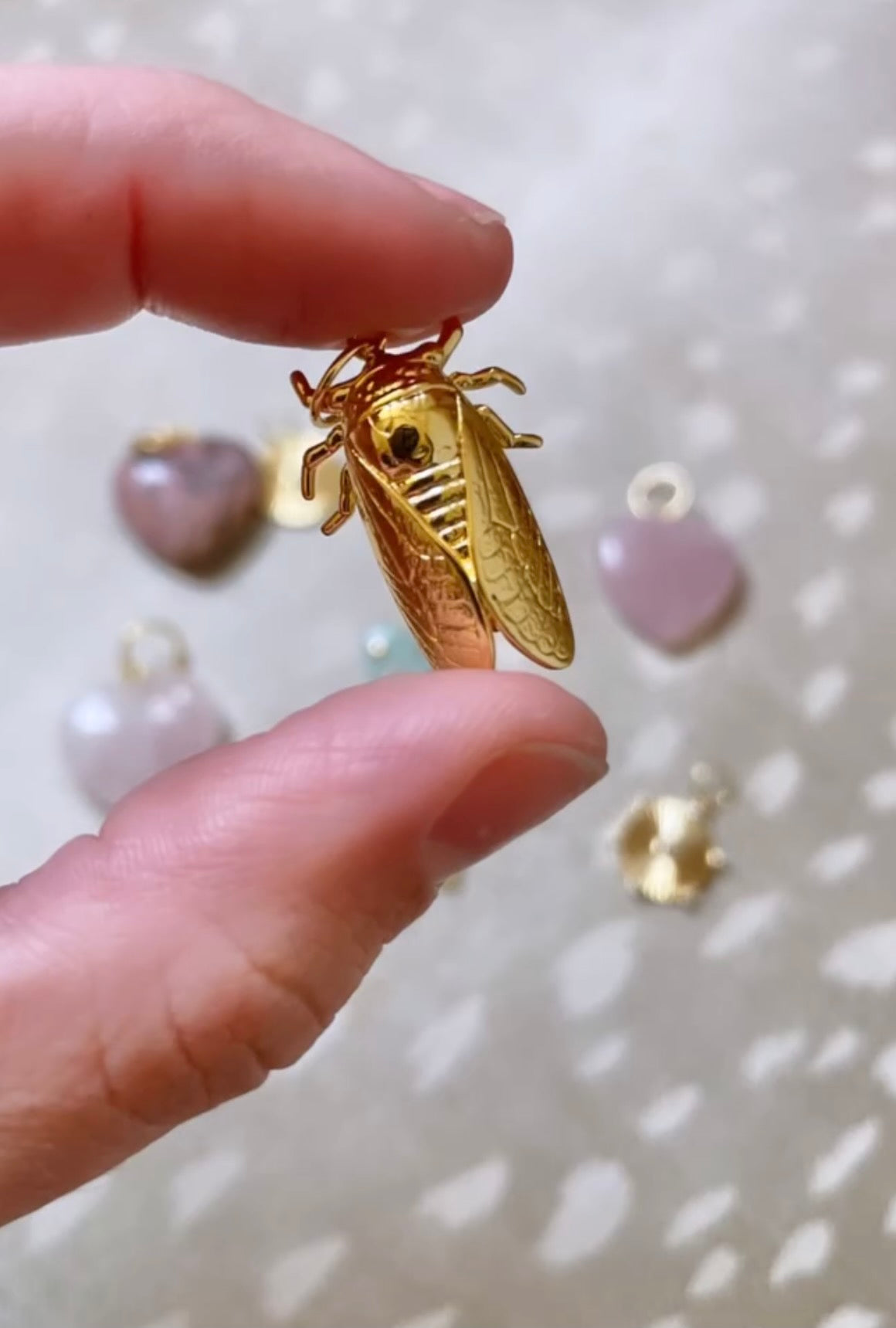 Delicate bug charm with intricate detailing.