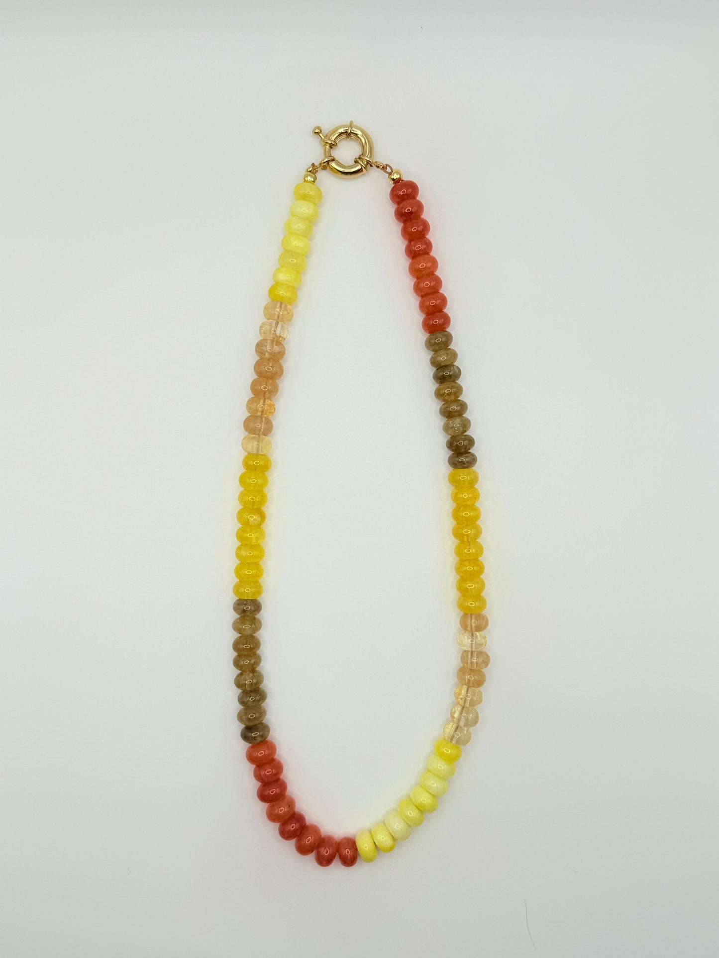 Trendy colorblock beaded necklace with alternating colorful beads, ideal for adding a playful touch to any outfit.