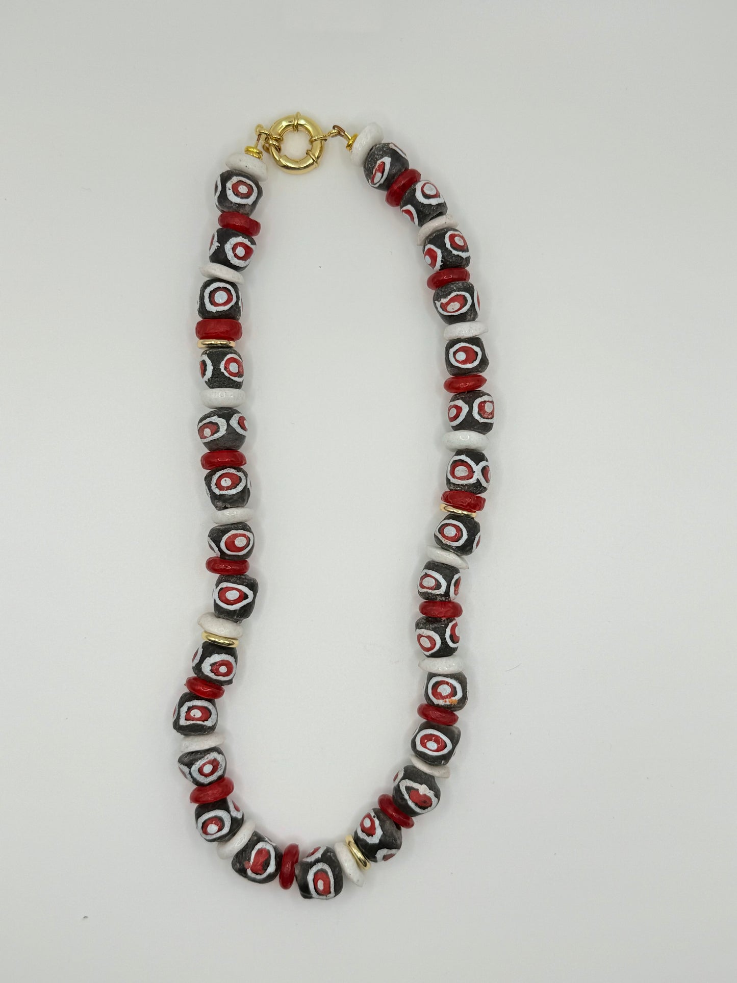 Red, white and black beaded necklace with large beads, perfect for bold and trendy fashion.