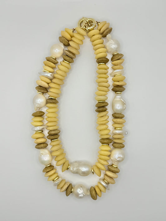 Fashionable cream and brown wooden chunky necklace designed with chunky wooden beads, adding a touch of nature-inspired charm.