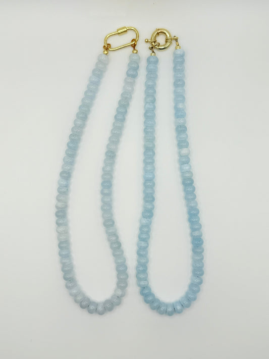 Stylish sky blue necklace featuring layered bracelets in soft, calming blue tones, perfect for a serene and chic look.