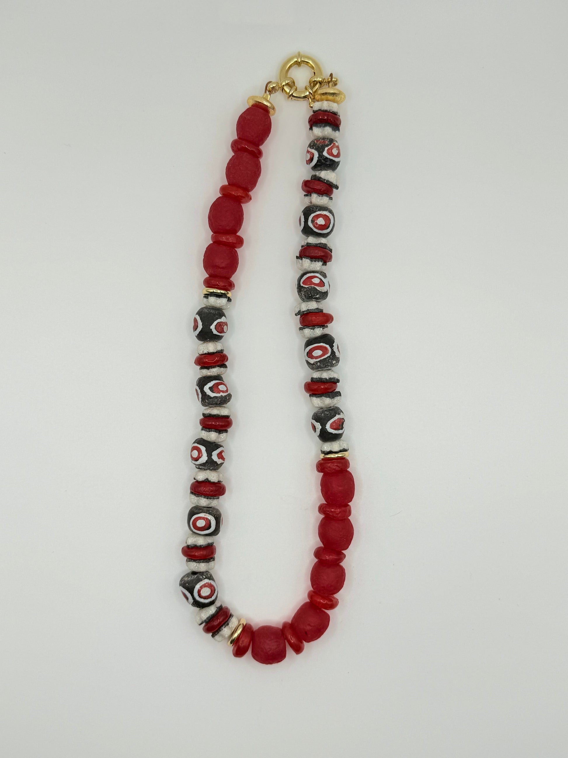 White, red and black beaded necklace, featuring chunky beads for a contemporary style.