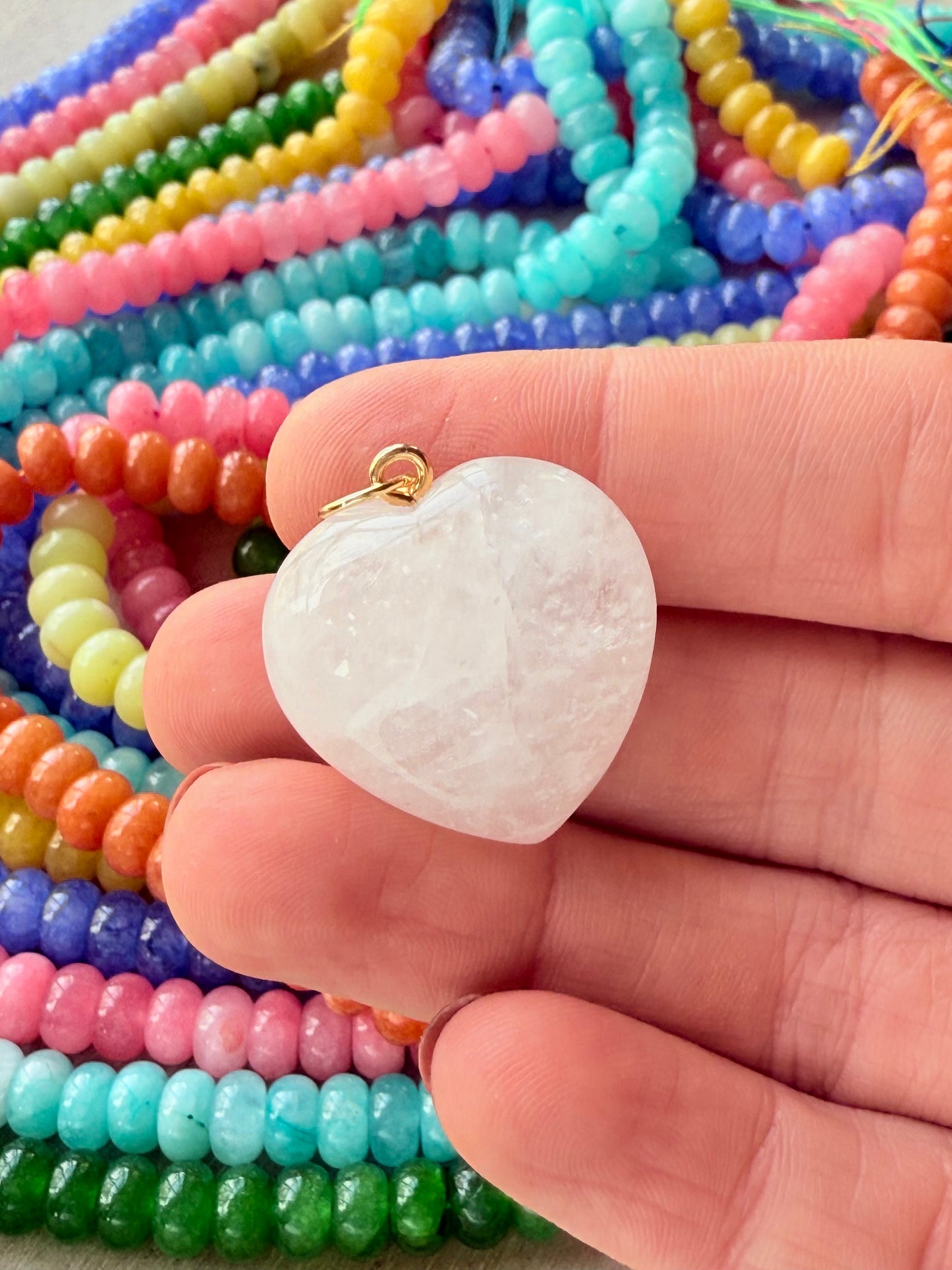 Whimsical white puffy heart charm, ideal for creating a cheerful and eye-catching look.