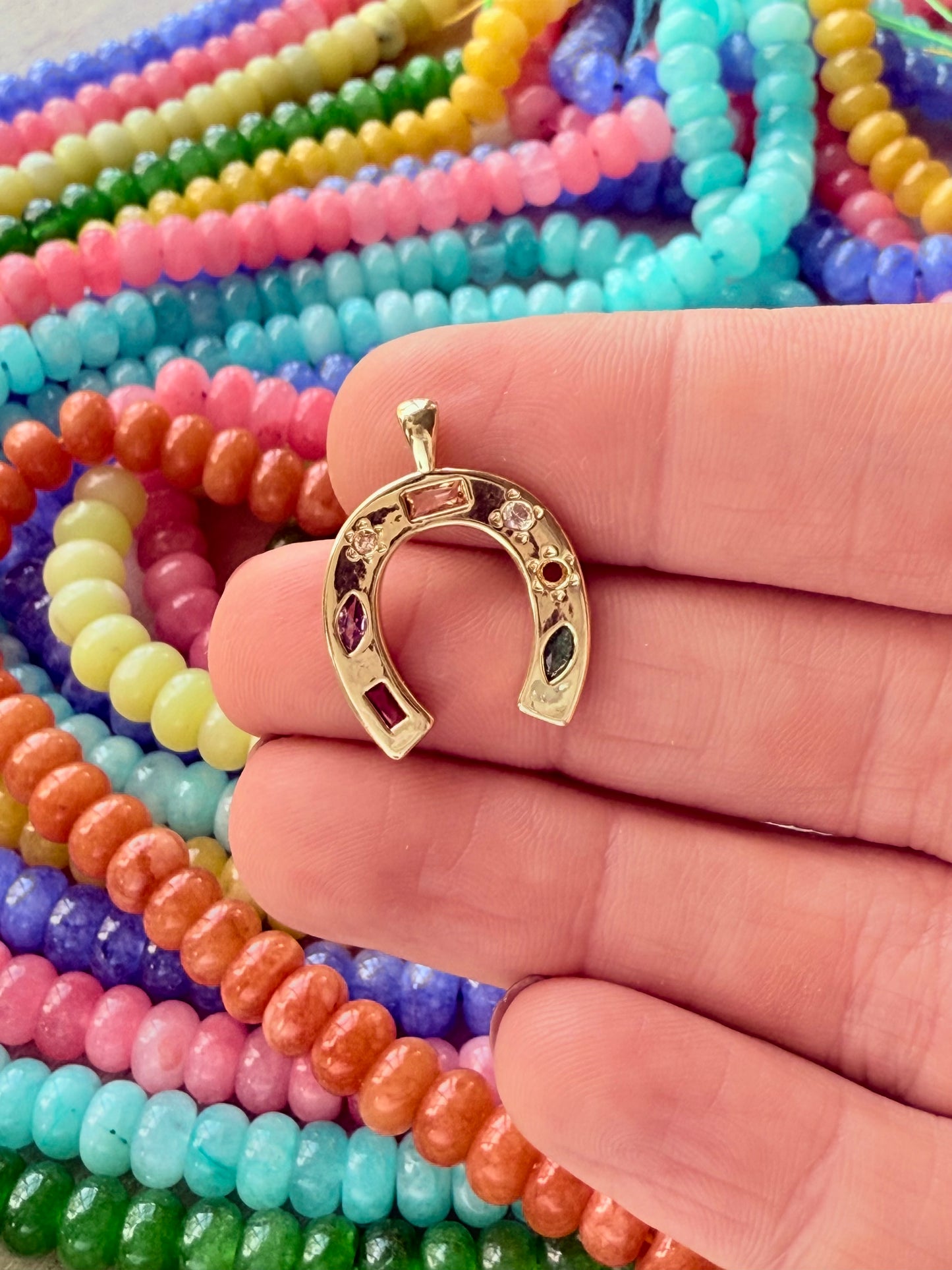 Colorful disco horseshoe charm with a sparkling finish, ideal for adding a fun, retro touch to personalized jewelry.