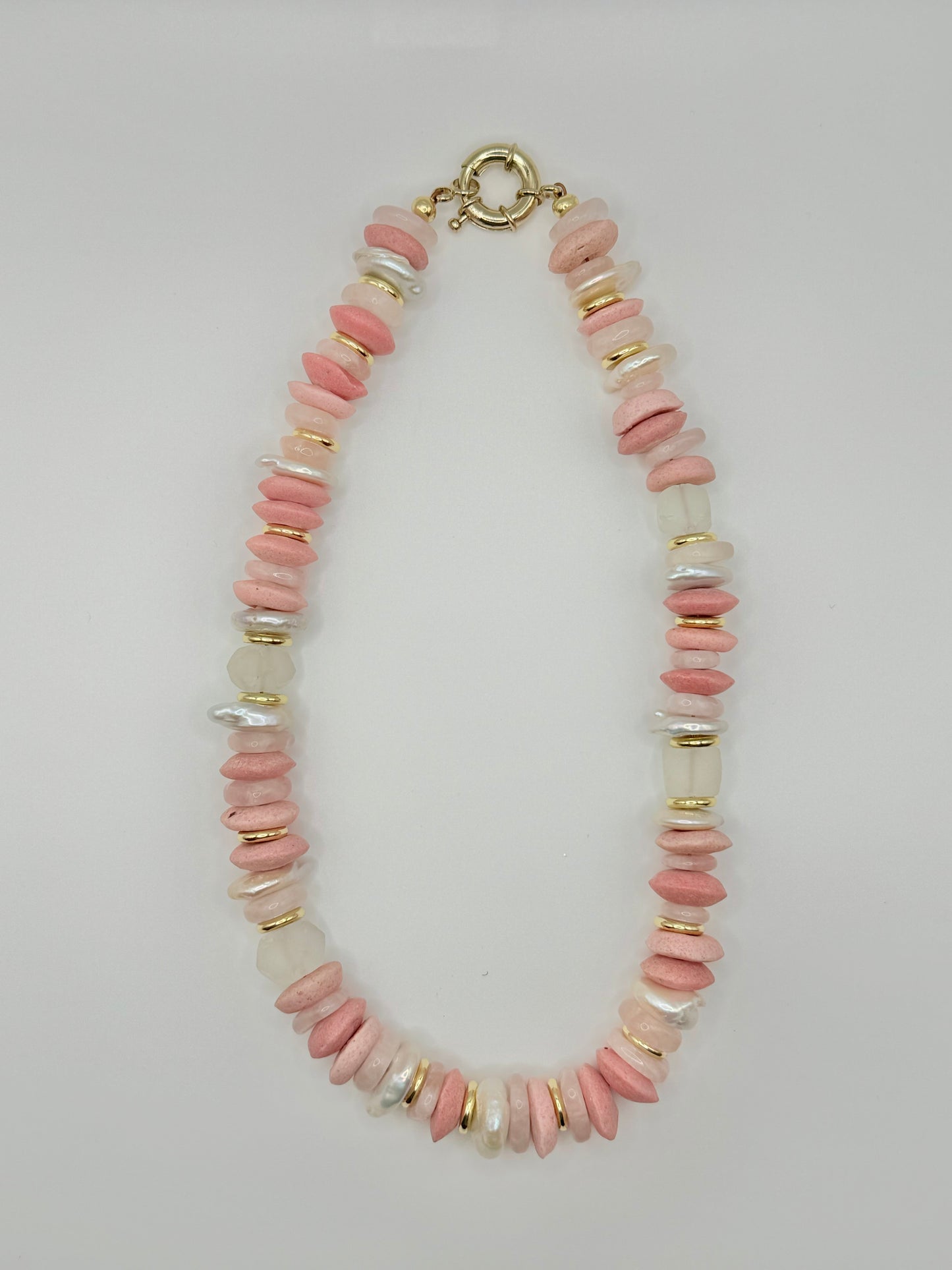 Bold chunky peach beaded necklace with oversized beads, perfect for making a vibrant fashion statement and adding a pop of color.